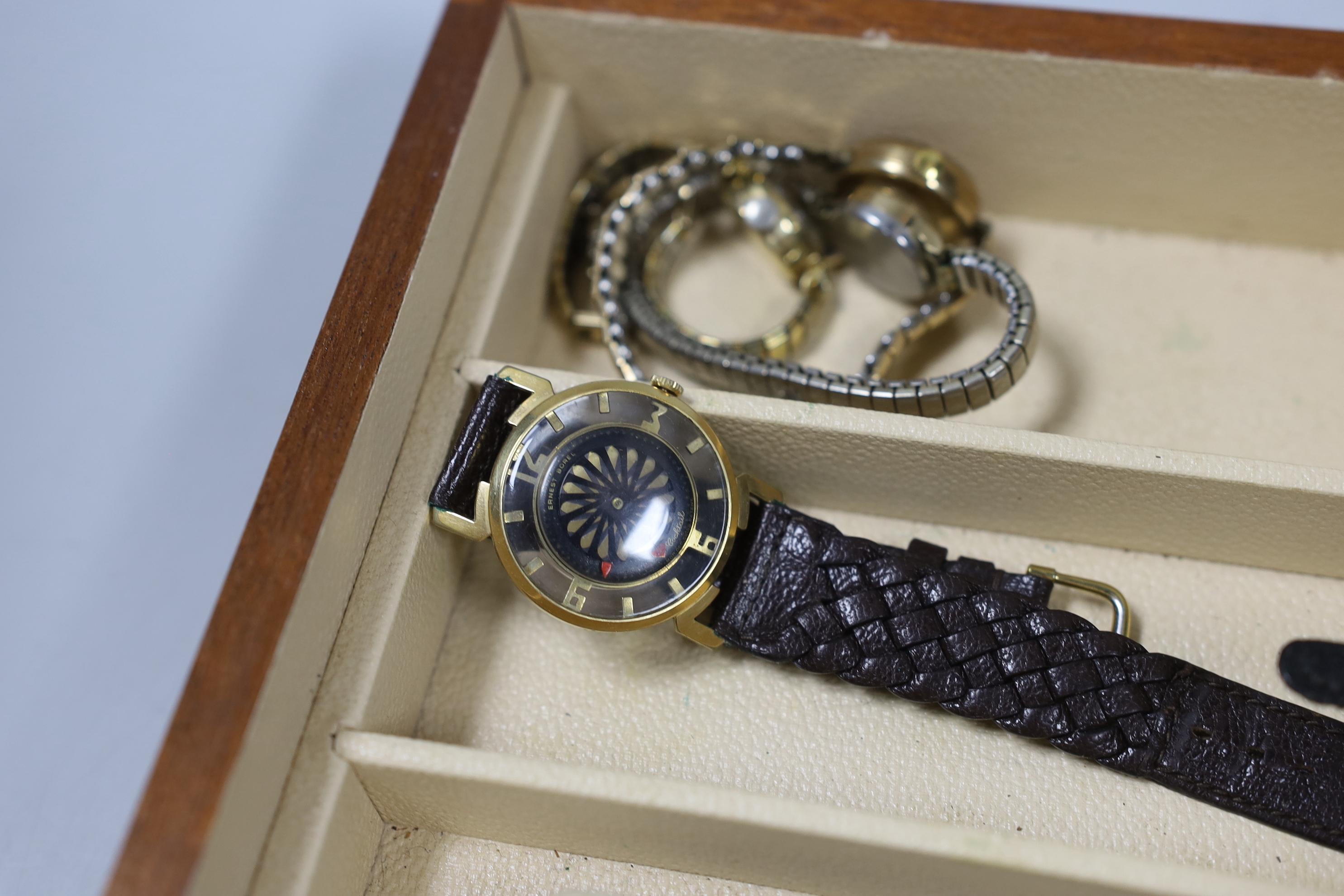 Seventeen assorted lady's or gentleman's wrist watches including a silver manual wind Omega, circa 1917 and a stainless steel Tudor, together with a pedometer?